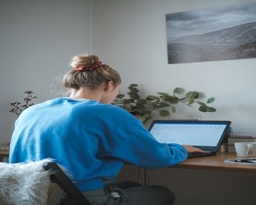 A person taking a screen break at an office desk